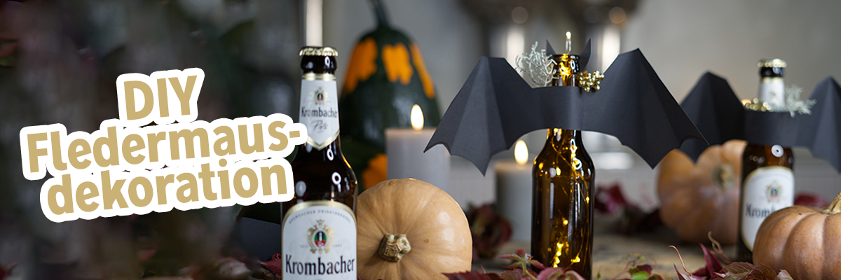 Halloween dekorierte braune Flaschen mit Text: DIY Fledermausdekoration.