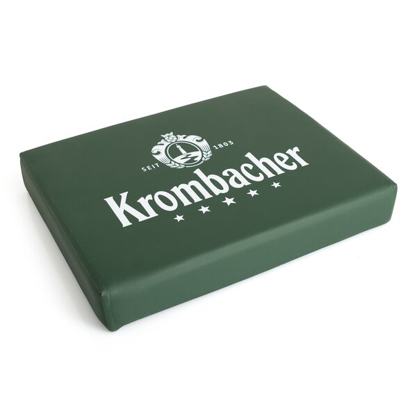 Grün gepolsterte rechteckige Bierkistenauflage mit weißem Krombacher-Logo, fünf Sternen und dem Text 'Seit 1803'.